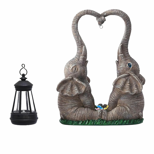 Dārza dekoratīvā figūriņa ar saules enerģiju darbināmu LED ziloni un laternu